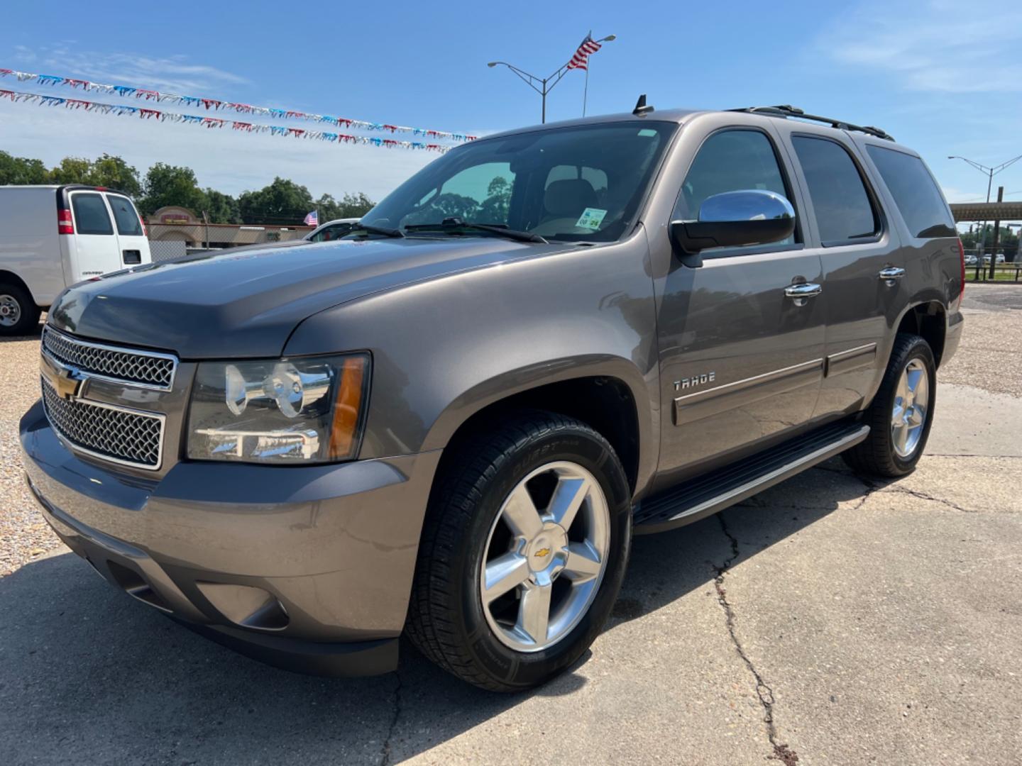 2014 Brown /Tan Chevrolet Tahoe LS (1GNSCAE04ER) with an 5.3L V8 engine, Automatic transmission, located at 4520 Airline Hwy, Baton Rouge, LA, 70805, (225) 357-1497, 30.509325, -91.145432 - 2014 Chevy Tahoe LS 5.3 V8 Gas, 147K Miles, 8 Passenger Seating, Backup Camera, Power Windows, Locks & Mirrors, Cold A/C, Tow Pkg. FOR INFO PLEASE CONTACT JEFF AT 225 357-1497 CHECK OUT OUR A+ RATING WITH THE BETTER BUSINESS BUREAU WE HAVE BEEN A FAMILY OWNED AND OPERATED BUSINESS AT THE SAME LOCA - Photo#0